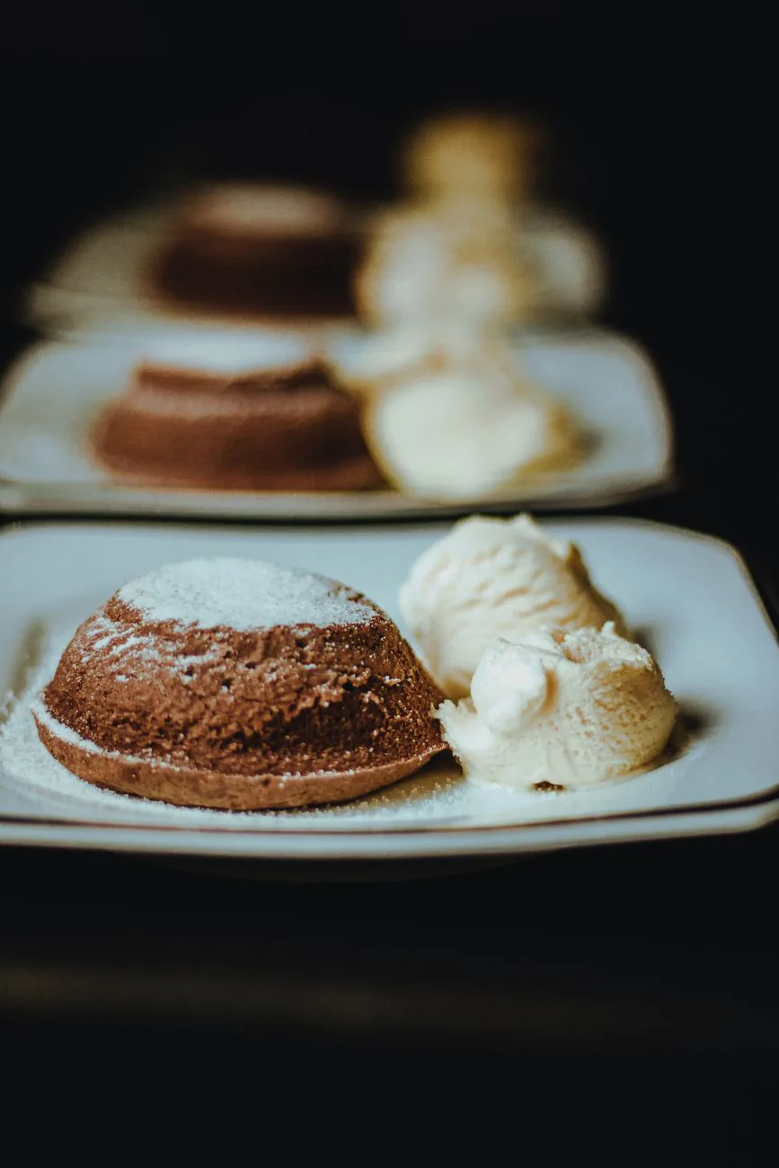 Chocolate dessert with creamy ice cream on a white plate